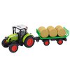 Zeleny_traktor_s_privesem_a_baliky_sena_1