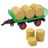 Zeleny_traktor_s_privesem_a_baliky_sena_5